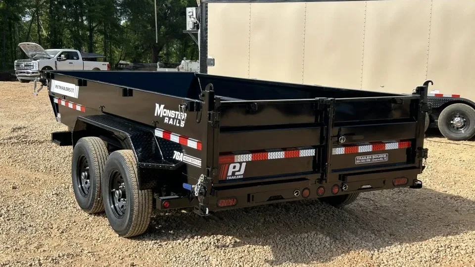 A tandem-axle PJ dump trailer on the gravel at Trailer Source in Greenville, South Carolina, the kind of work trailer most rent-to-own customers are after