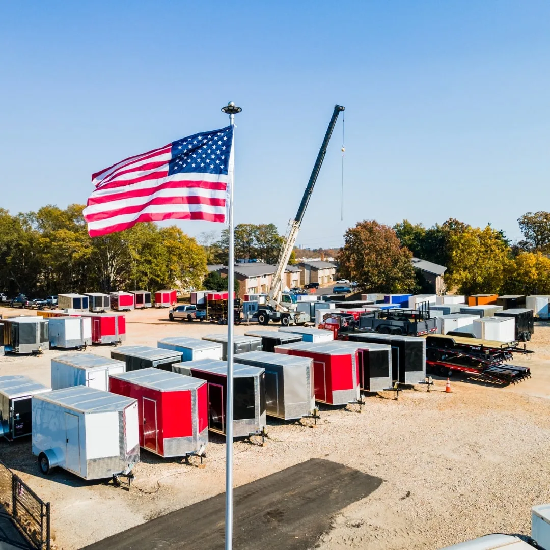 A row of enclosed and utility trailers at the Trailer Source lot in Greenville